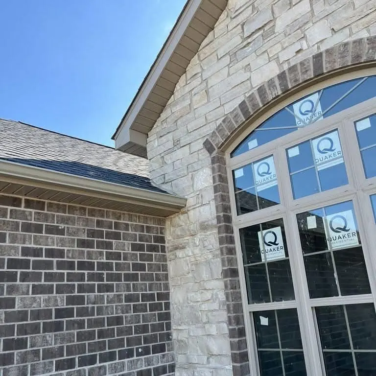 Soffit and gutter line on a new stone and brick house